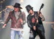LAS VEGAS, NV - MAY 21: Singer Axl Rose (L) and guitarist Dj Ashba of Guns N' Roses perform at The Joint inside the Hard Rock Hotel & Casino during the opening night of the band's second residency, "Guns N' Roses - An Evening of Destruction. No Trickery!" on May 21, 2014 in Las Vegas, Nevada. (Photo by Ethan Miller/Getty Images)