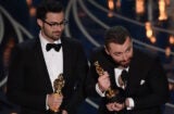 Singer Sam Smith (R) and Composer Jimmy Napes accept their award for Best Song, Spectre on stage at the 88th Oscars on February 28, 2016 in Hollywood, California. AFP PHOTO / MARK RALSTON / AFP / MARK RALSTON        (Photo credit should read MARK RALSTON/AFP/Getty Images)