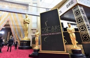 People mingle by Academy Award statuettes on display at Oscars on Sunday, Feb. 28, 2016, at the Dolby Theatre in Los Angeles. (Photo by Jordan Strauss/Invision/AP)