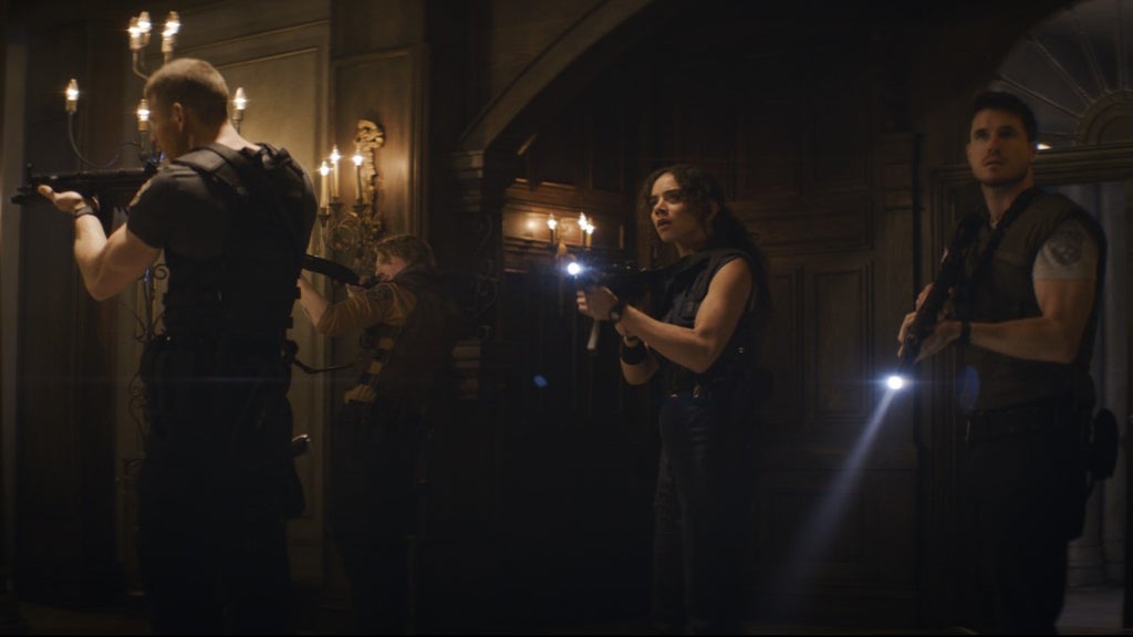 Albert Wesker (Tom Hopper), Richard Aiken (Chad Rook), Jill Valentine (Hannah John-Kamen), and Chris Redfield (Robbie Amell)