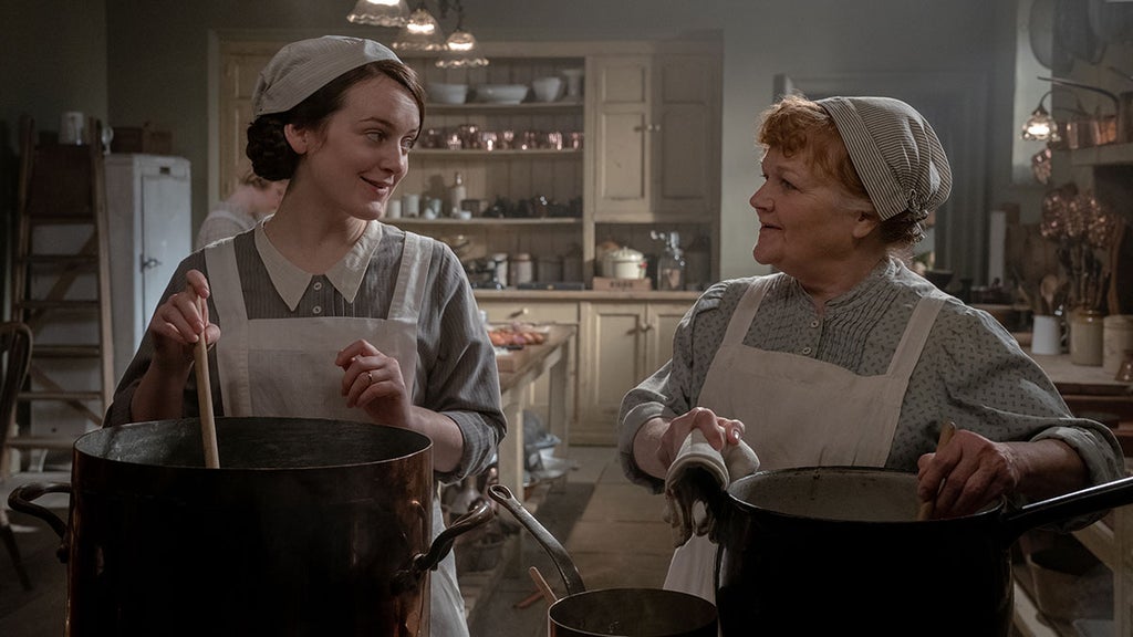 Sophie McShera stars as Daisy and Lesley Nicol stars as Mrs. Patmore in Downton Abbey: A New Era