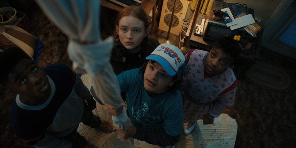 Caleb McLaughlin as Lucas Sinclair, Sadie Sink as Max Mayfield, Gaten Matarazzo as Dustin Henderson, and Priah Ferguson as Erica Sinclair in "Stranger Things" (Netflix)