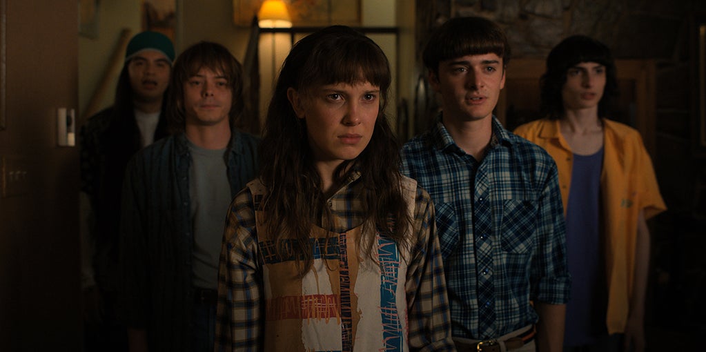 Eduardo Franco as Argyle, Charlie Heaton as Jonathan, Millie Bobby Brown as Eleven, Noah Schnapp as Will Byers, and Finn Wolfhard as Mike Wheeler in "Stranger Things" (Netflix)