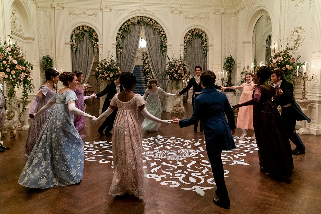 Shelley Conn as Mary Sharma, Ruth Gemmell as Lady Violet Bridgerton, Simone Ashley as Kate Sharma, Luke Newton as Colin Bridgerton, Charithra Chandran as Edwina Sharma, Claudia Jessie as Eloise Bridgerton, Luke Thompson as Benedict Bridgerton, Will Tilston as Gregory Bridgerton, Florence Emilia Hunt as Hyacinth Bridgerton, Adjoa Andoh as Lady Danbury, Jonathan Bailey as Anthony Bridgerton in episode 207 of "Bridgerton" (Liam Daniel/Netflix)