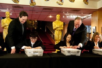 Rick Rosas and Brad Oltmanns supervise Oscar ballot mailing