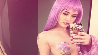 Twerk or Treat: Miley Cyrus Is a Half-Topless Lil’ Kim for Halloween (Photos)