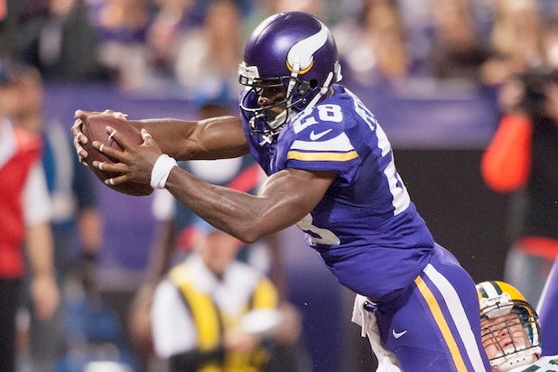 Adrian Peterson #28 of the Minnesota Vikings carries the football for a touchdown