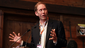 Henry Blodget of Business Insider gestures with both hands as he speaks.