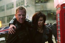 ’24: Live Another Day’: Jack Bauer Walks Toward Danger, Gun Drawn, Girl on Arm (Video)