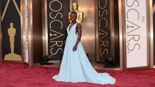 Oscars: Lupita Nyong’o’s Dress Dazzles, She Plays It Cool on the Red Carpet (Video)