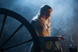 Elle Fanning Pricks Her Finger on Spinning Wheel as Angelina Jolie Rides in ‘Malifecent’ Clip (Video)