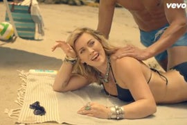 Hilary Duff Dreams of Bikinis and Beach Days in ‘Chasing the Sun’ Music Video