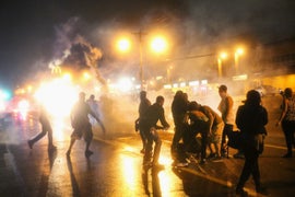 U.S. Attorney General Orders Federal Autopsy on Michael Brown, as Ferguson Protests Leave 1 Shot