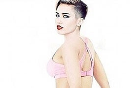 Miley Cyrus Spoofs Nicki Minaj’s Backside-Baring ‘Anaconda’ Pose (Photos)