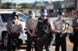 Police in riot gear watch over a protest in Ferguson, Missouri, Aug. 13, 2014 (Getty Images)