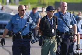 Shoving, Arrests and Alleged Brutality: A Timeline of Tension Between Police and the Press in Ferguson