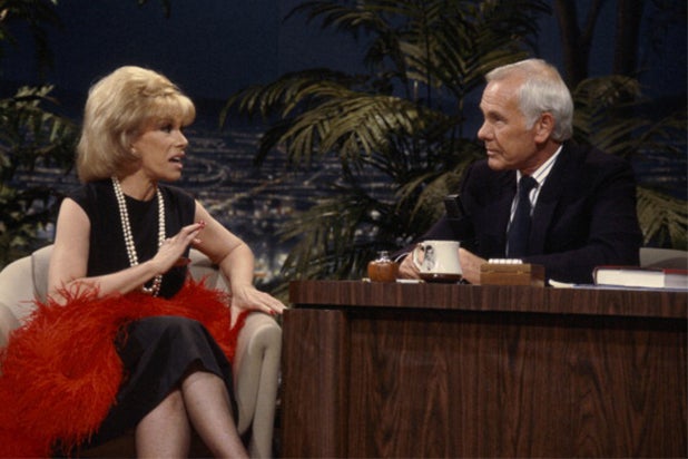 Caption:THE TONIGHT SHOW STARRING JOHNNY CARSON -- Air Date 04/25/1986 -- Pictured: (l-r) Actress/comedian Joan Rivers during an interview with host Johnny Carson on April 25, 1986 (Photo by Paul Drinkwater/NBC/NBCU Photo Bank via Getty Images)