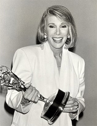 Joan Rivers wins a Daytime Emmy in 1990 for the Joan Rivers Show Joan Rivers wins a Daytime Emmy in 1990 for the Joan Rivers Show