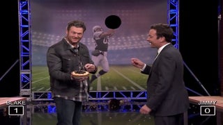 Blake Shelton and Jimmy Fallon Are Terrible at ‘Random Object Football Toss’ (Video)