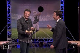 Blake Shelton and Jimmy Fallon Are Terrible at ‘Random Object Football Toss’ (Video)