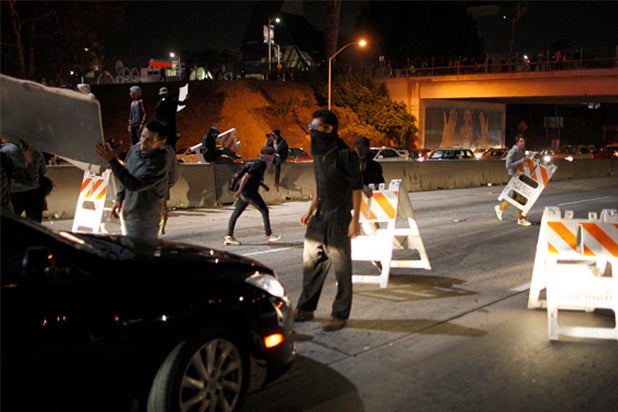 LOS ANGELES, CA - NOVEMBER 25: Protesters set up barricades and shut down the 101 freeway following the grand jury decision not to indict a white police officer who had shot dead an unarmed black teenager in Ferguson, Missouri on the night of November 25, 2014 in Los Angeles, California. Police officer Darren Wilson shot 18-year-old Michael Brown on August 9, sparking large ongoing protests. (Photo by David McNew/Getty Images) LOS ANGELES, CA - NOVEMBER 25: Protesters set up barricades and shut down the 101 freeway following the grand jury decision not to indict a white police officer who had shot dead an unarmed black teenager in Ferguson, Missouri on the night of November 25, 2014 in Los Angeles, California. Police officer Darren Wilson shot 18-year-old Michael Brown on August 9, sparking large ongoing protests. (Photo by David McNew/Getty Images)
