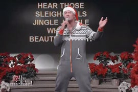 Dwayne ‘The Rock’ Johnson Sings ‘Here Comes Santa Claus’ in a Onesie (VIdeo)