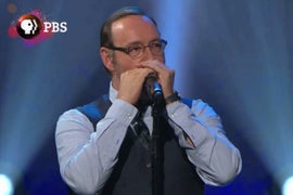 Kevin Spacey Sings, Plays Harmonica on Billy Joel’s ‘Piano Man’ PBS Tribute (Video)