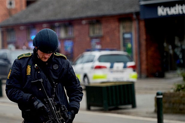 A Firearms police officer stands guard after a shooting after a public meeting and discussion arranged by the Lars Vilks Committee about Charlie Hebdo and freedom of speech in the Krudttonden Hall in the Osterbro area on February 14, 2015 in Copenhagen, Denmark. The french ambassador in Denmark was also in attendance at the meeting. (Photo by Lars Ronbog/Getty Images)