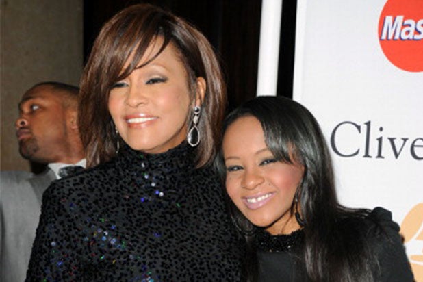 Singer Whitney Houston (L) and Bobbi Kristina Brown arrives at the 2011 Pre-GRAMMY Gala and Salute To Industry Icons Honoring David Geffen at Beverly Hilton on February 12, 2011 in Beverly Hills, California. (Photo by Jason Merritt/Getty Images)