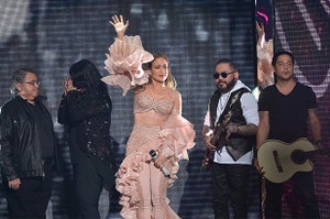 MIAMI, FL - APRIL 30: Jennifer Lopez and Los Dinos onstage after performing musical tribute to Selena at the 2015 Billboard Latin Music Awards presented bu State Farm on Telemundo at Bank United Center on April 30, 2015 in Miami, Florida. (Photo by Rodrigo Varela/Getty Images)