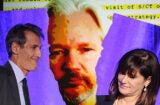Sony Pictures Entertainment CEO Michael Lyntonwith former SPE President Amy Pascal; WikiLeaks founder Julian Assange (Kevin Winter/Hannah Peters/Getty Images)