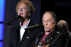 CULVER CITY, CA - JUNE 10: Musicians Art Garfunkel and Paul Simon of Simon & Garfunkel perform during the 38th AFI Life Achievement Award honoring Mike Nichols held at Sony Pictures Studios on June 10, 2010 in Culver City, California. The AFI Life Achievement Award tribute to Mike Nichols will premiere on TV Land on