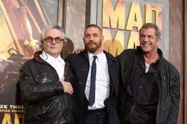 Mel Gibson Drops in on Tom Hardy at ‘Mad Max: Fury Road’ Los Angeles Premiere (Photos)