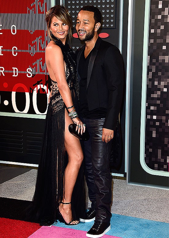 LOS ANGELES, CA - AUGUST 30: Model Chrissy Teigen (L) and recording artist John Legend attend the 2015 MTV Video Music Awards at Microsoft Theater on August 30, 2015 in Los Angeles, California. (Photo by Frazer Harrison/Getty Images)