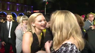 Jennifer Lawrence Accidentally Kisses Natalie Dormer at ‘Hunger Games’ Premiere – and She ‘Liked It’ (Video)