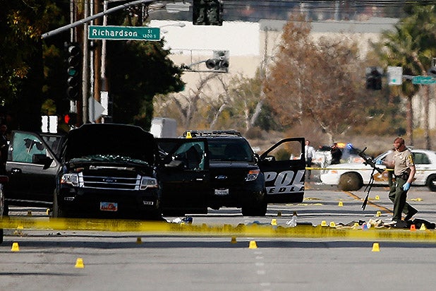 SAN BERNARDINO, CA - DECEMBER 03: FBI and local law enforcement move a weapon and compile evidence at the scene where suspects of the shooting at the Inland Regional Center were killed on December 3, 2015 in San Bernardino, California. Police continue to investigate a mass shooting at the Inland Regional Center in San Bernardino that left at least 14 people dead and another 17 injured. (Photo by Sean M. Haffey/Getty Images)