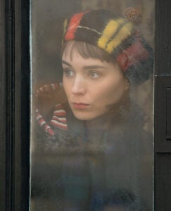 Rooney Mara's Therese looks out a window, a continuing motif in "Carol"