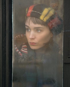 Rooney Mara's Therese looks out a window, a continuing motif in "Carol"