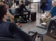 A man streams a Netflix show in an airport