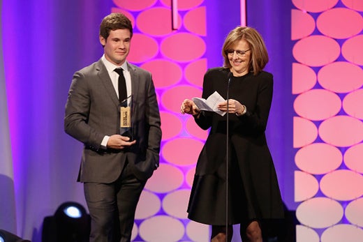 BEVERLY HILLS, CA - FEBRUARY 08: Writer Nancy Meyers (R) accepts the Best Comedy award for 'The Intern' from actor Adam Devine onstage at the AARP's 15th Annual Movies For Grownups Awards at the Beverly Wilshire Four Seasons Hotel on February 8, 2016 in Beverly Hills, California. (Photo by Gabriel Olsen/Getty Images for AARP)