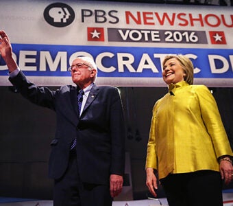 Bernie-Sanders-and-Hillary-Clinton-Enter-PBS-NewsHour-Democratic-Debate-340x300.jpg