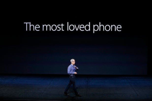Apple CEO Tim Cook introduces a new iPhone model in 2015