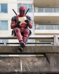 DEADPOOL Ryan Reynolds as Deadpool relaxes before leaping into battle. Photo Credit: David Dolsen TM & © 2015 Marvel & Subs.  TM and © 2015 Twentieth Century Fox Film Corporation.  All rights reserved.  Not for sale or duplication.