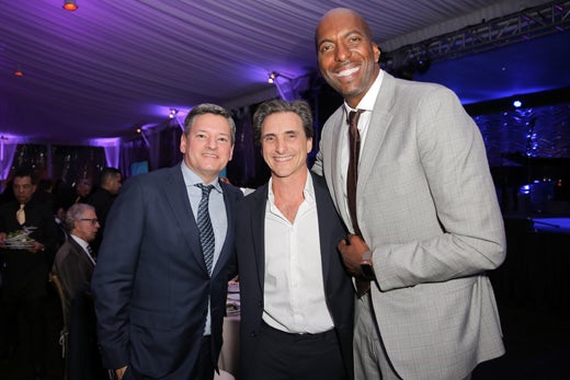 Honoree Ted Sarandos, Lawrence Bender, and host John Salley. (Getty Images)
