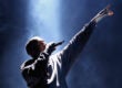 Kanye West performs under a spotlight