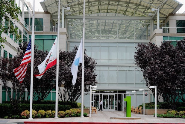 Flags fly at half staff following the death of Steve Jobs at the Apple headquarters