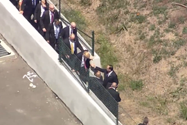 Watch Donald Trump Hop a Fence to Avoid Protesters (Video)