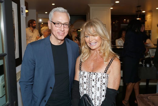 "LOS ANGELES, CA - MAY 03: Dr. Drew Pinsky and honoree Goldie Hawn attend Russell Simmons' Rush Philanthropic Arts Foundation's inaugural Art For Life Los Angeles at Private Residence on May 3, 2016 in Los Angeles, California. (Photo by Randy Shropshire/Getty Images for The Rush Philanthropic Art Foundation)"