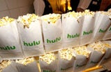 Popcorn bags with the Hulu logo at a premiere event