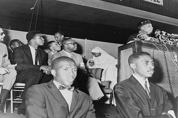 Muhammad Ali attends a speech by Elijah Muhammad Muhammad Ali attends a speech by Elijah Muhammad